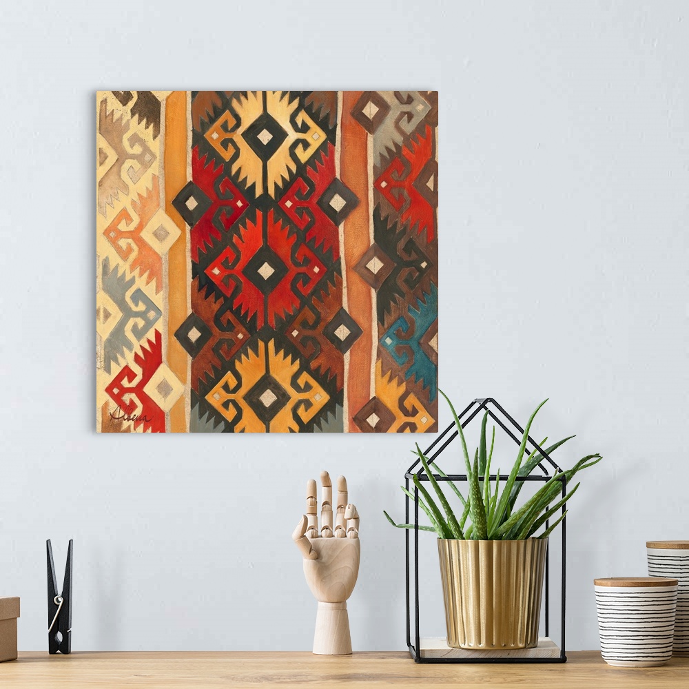 A bohemian room featuring Contemporary artwork of a geometric tribal pattern in earth tones.