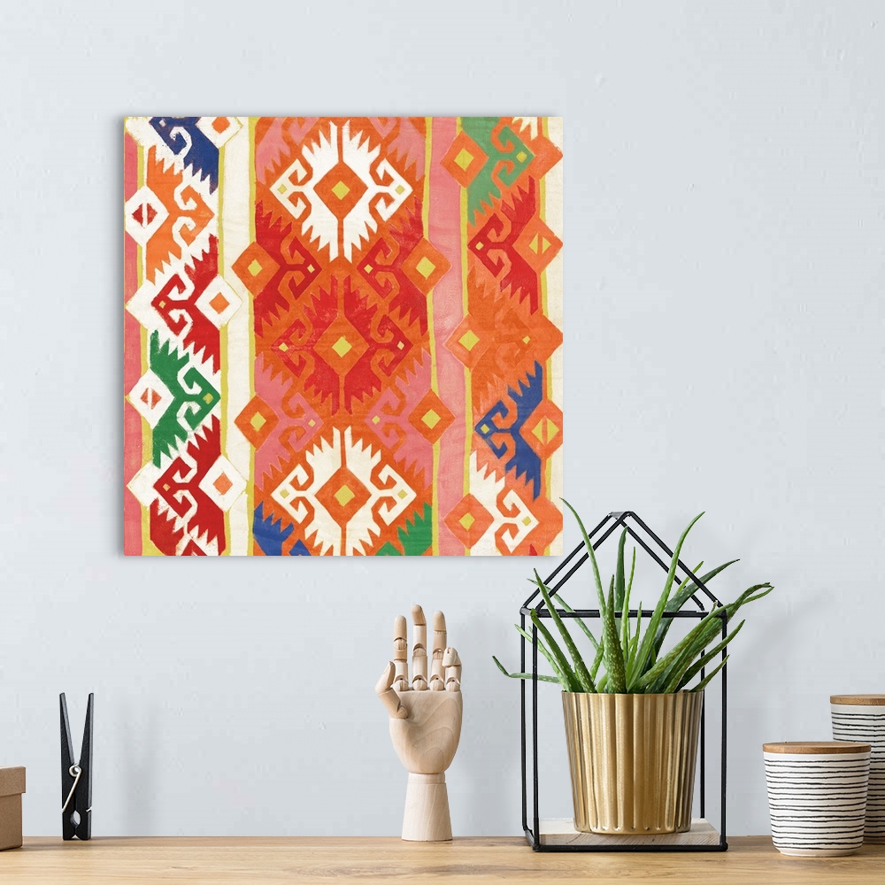 A bohemian room featuring Square artwork of southwest patterns in green, yellow, blue, orange and red.