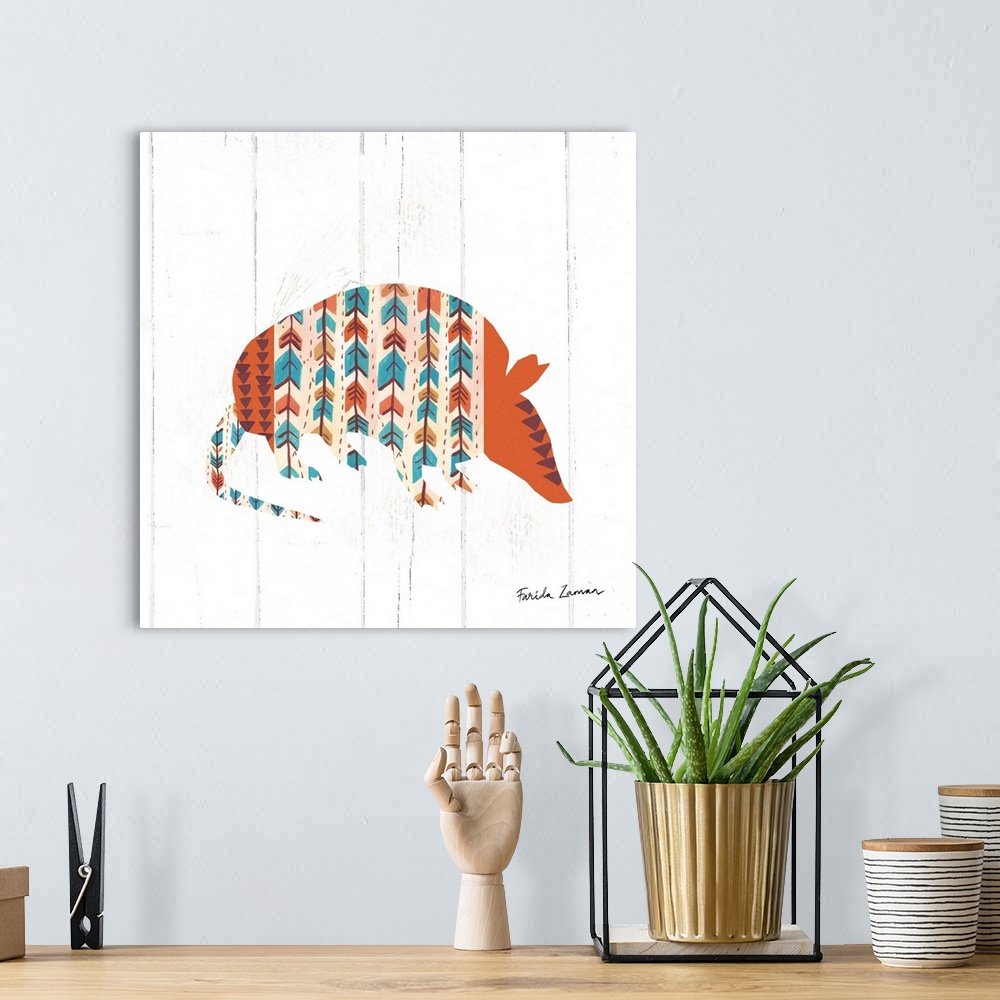A bohemian room featuring An illustration of an armadillos with a southwestern pattern on a white wood panel background.