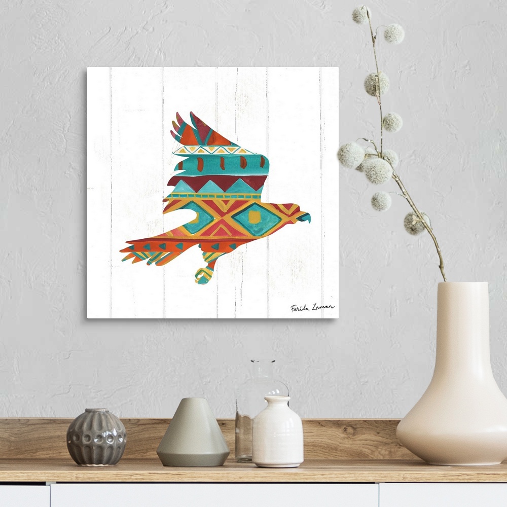 A farmhouse room featuring An illustration of a hawk with a southwestern pattern on a white wood panel background.