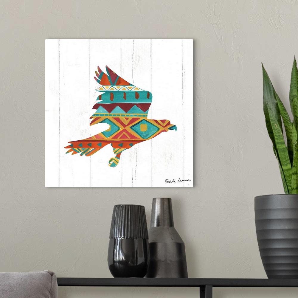A modern room featuring An illustration of a hawk with a southwestern pattern on a white wood panel background.
