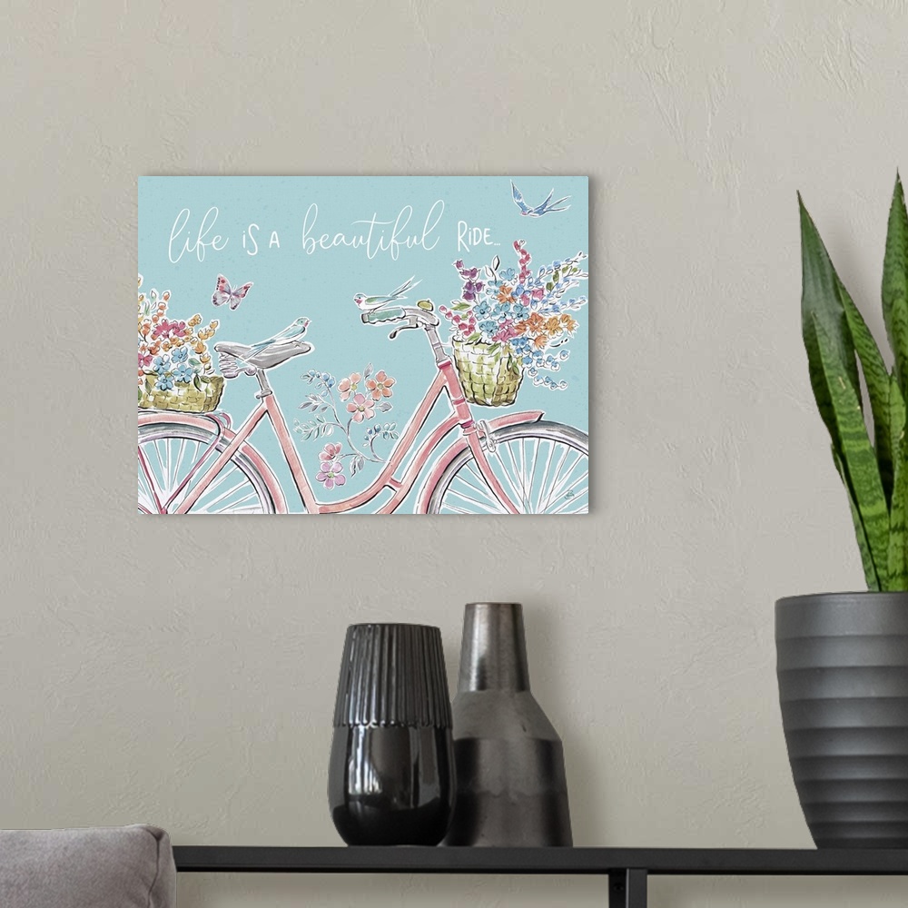 A modern room featuring Decorative artwork of a bicycle with flowers and the words, 'Life is a beautiful ride'.