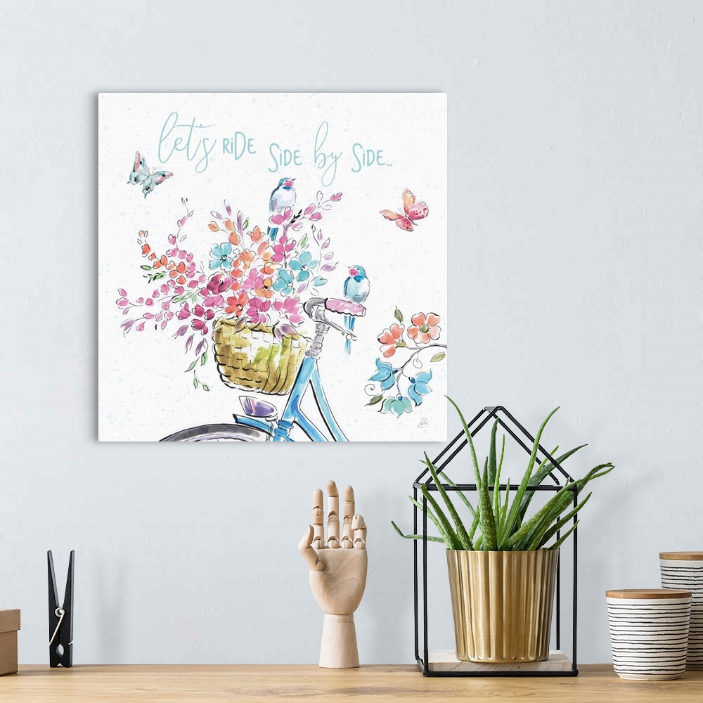A bohemian room featuring Decorative artwork of an illustrated bike with flowers and the words, 'Let's ride side by side......