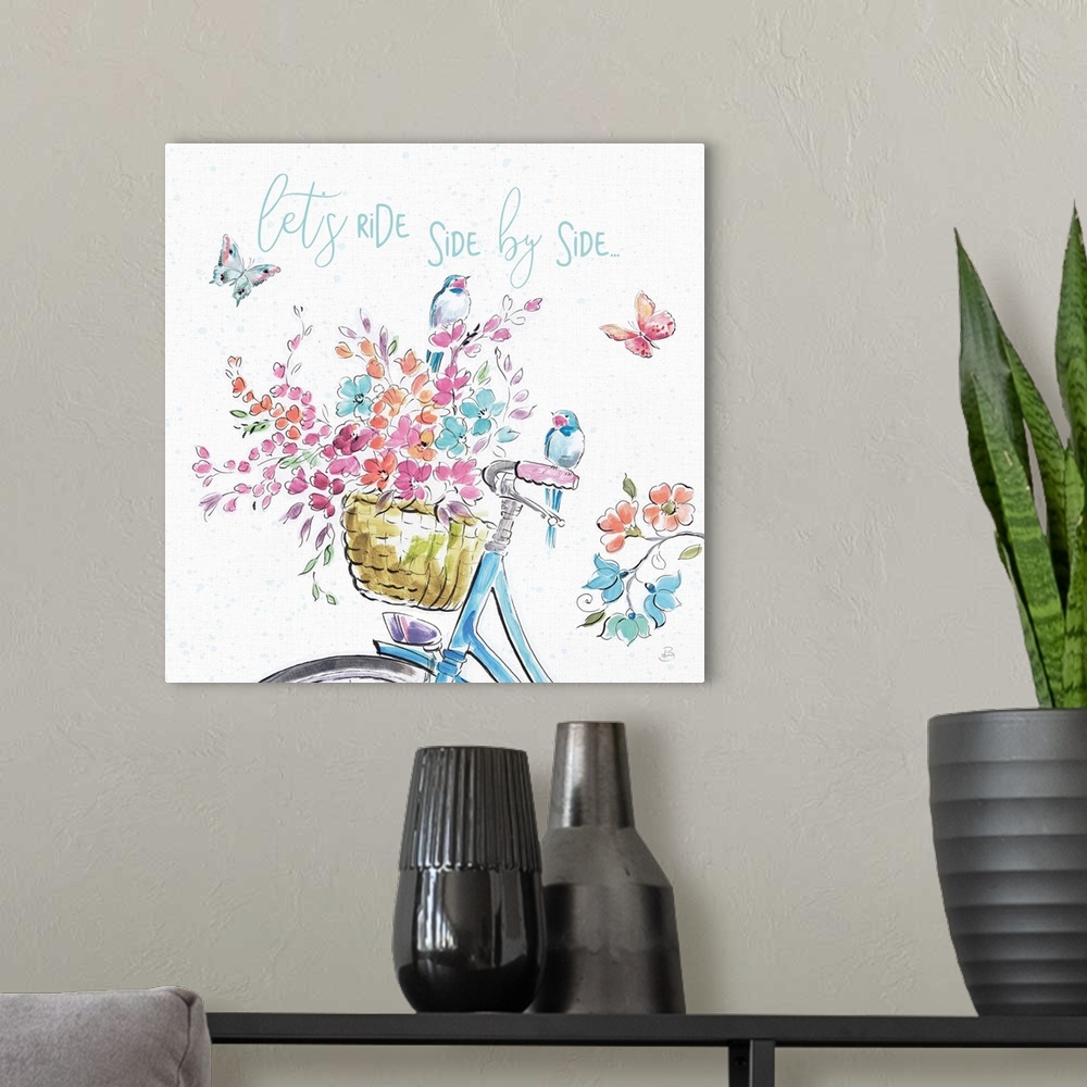 A modern room featuring Decorative artwork of an illustrated bike with flowers and the words, 'Let's ride side by side......
