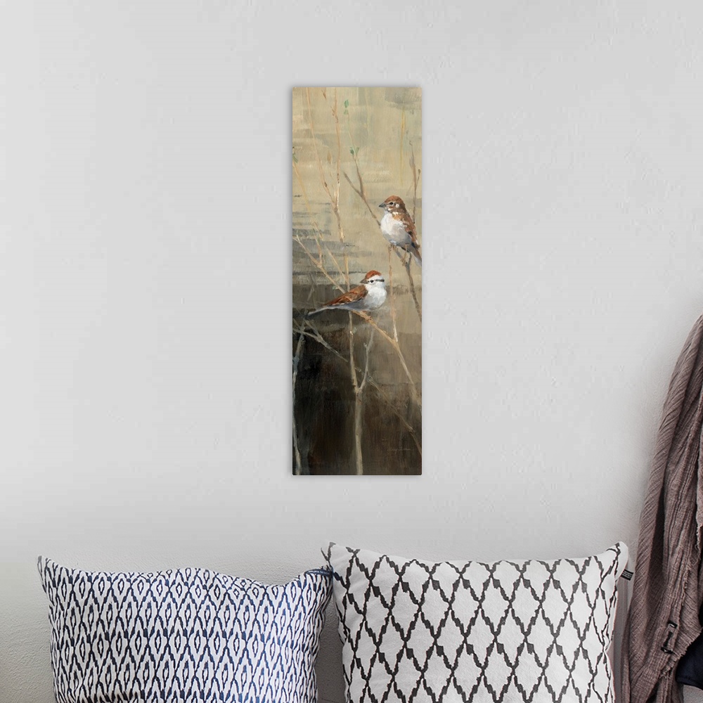 A bohemian room featuring Vertical panoramic painting of two birds perched on branches at dawn.