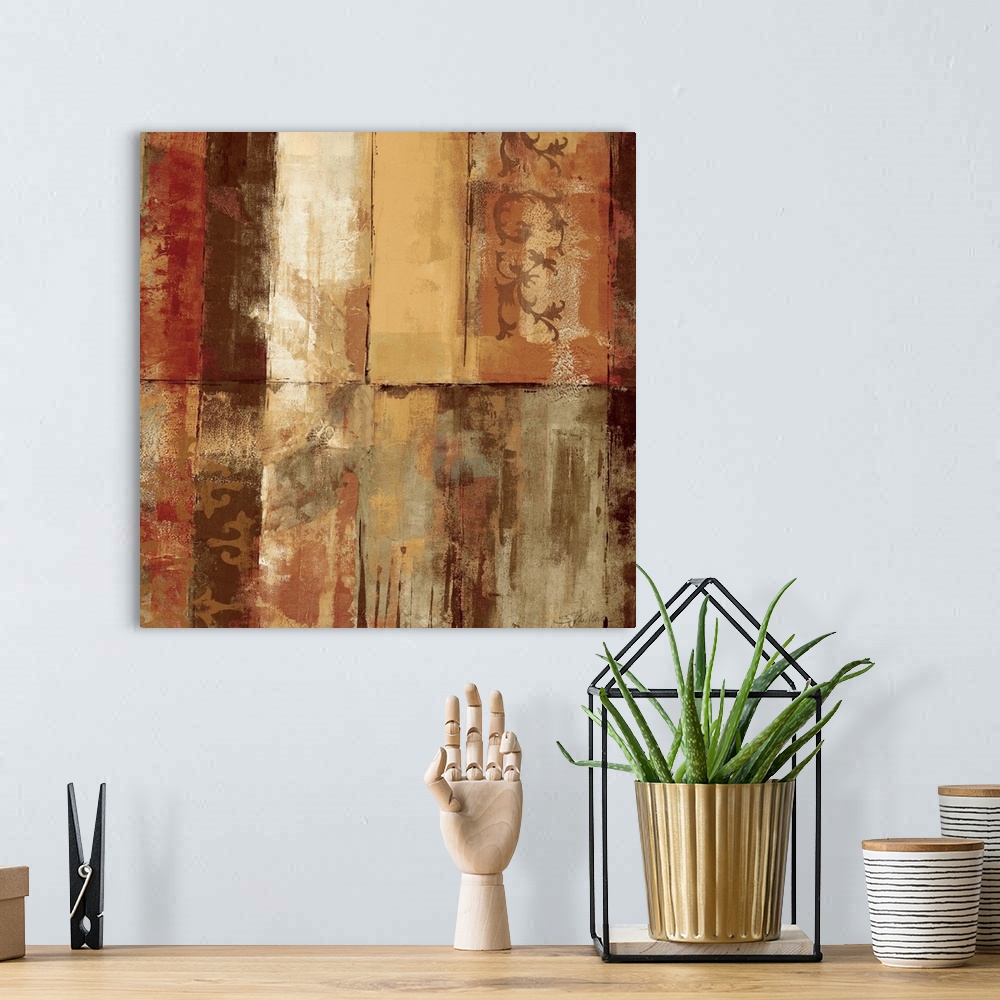 A bohemian room featuring Heavily textured earth toned abstract painting of various colored rectangles with stenciled decor...