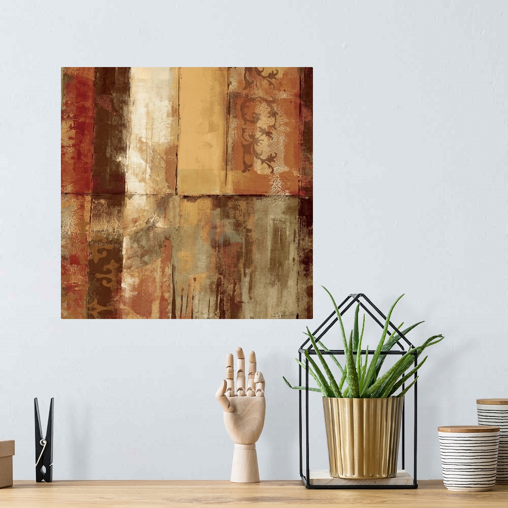 A bohemian room featuring Heavily textured earth toned abstract painting of various colored rectangles with stenciled decor...