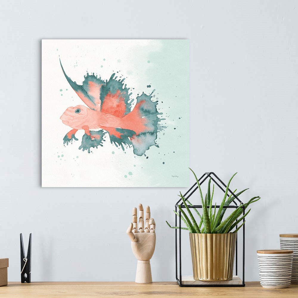 A bohemian room featuring Watercolor painting of a fish in blue and coral hues on a square background.