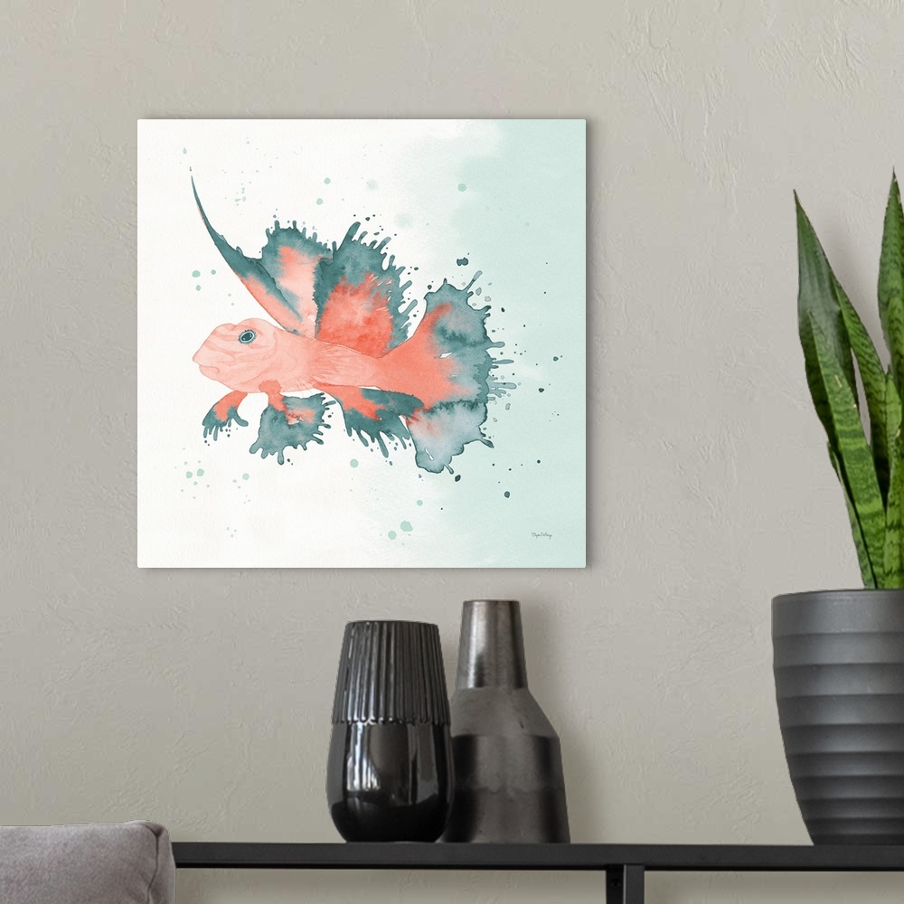 A modern room featuring Watercolor painting of a fish in blue and coral hues on a square background.