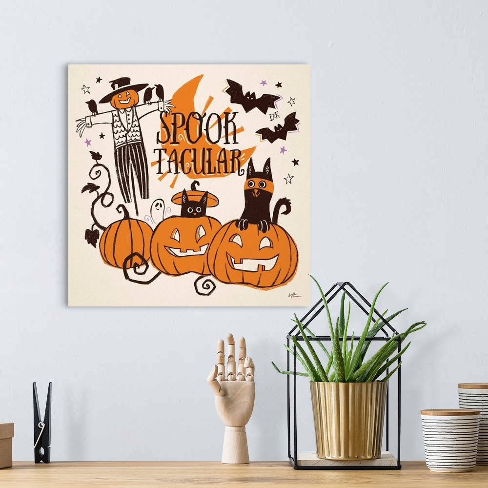 A bohemian room featuring Decorative Halloween decor featuring whimsical cats over a orange and black themed landscape.