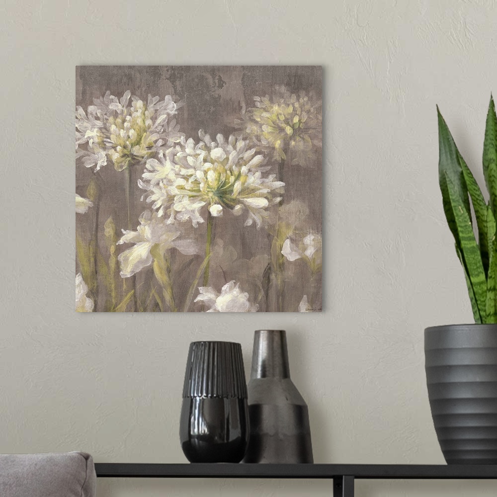 A modern room featuring Contemporary painting of white flowers on a tan background.