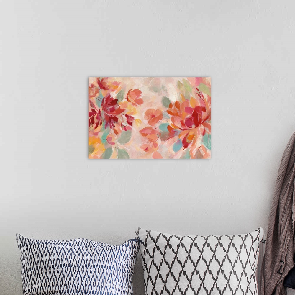 A bohemian room featuring Abstract painting of pink and red flowers with hints of warm orange, blue, green, and yellow hues.