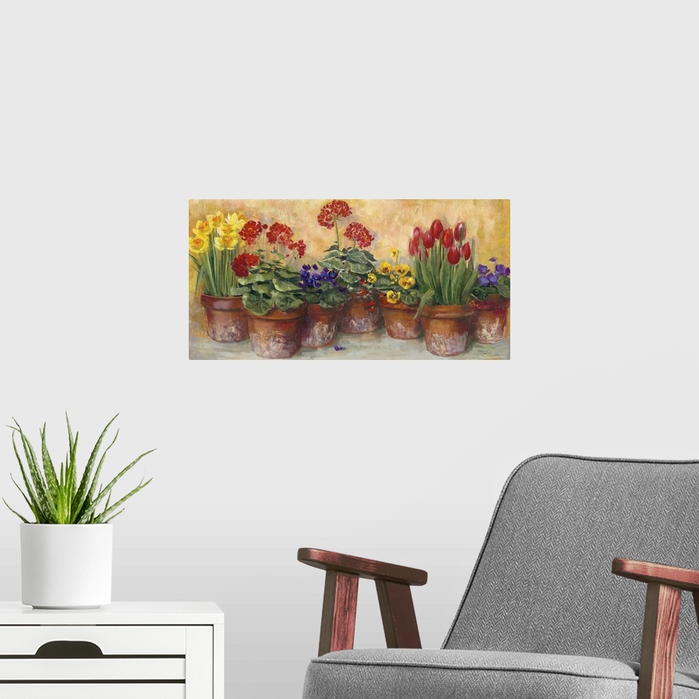 A modern room featuring A large horizontal painting of a row of potted flowers in warm colors.