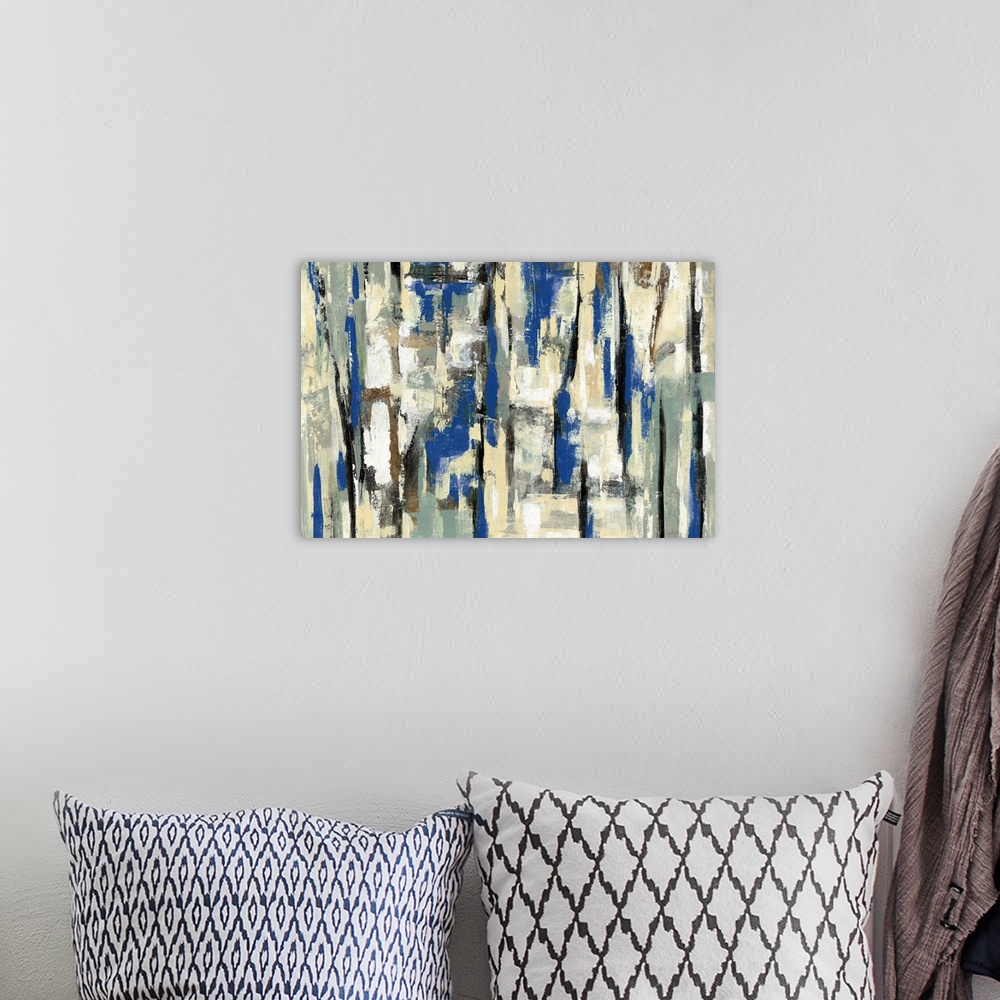 A bohemian room featuring Large abstract painting with layers of blue, tan, white, gold, and black hues.