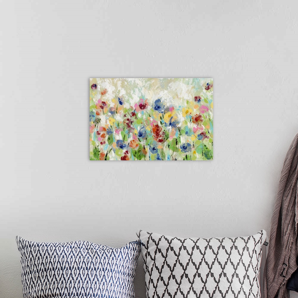 A bohemian room featuring Decorative artwork of whimsical abstract florals in bright colors.