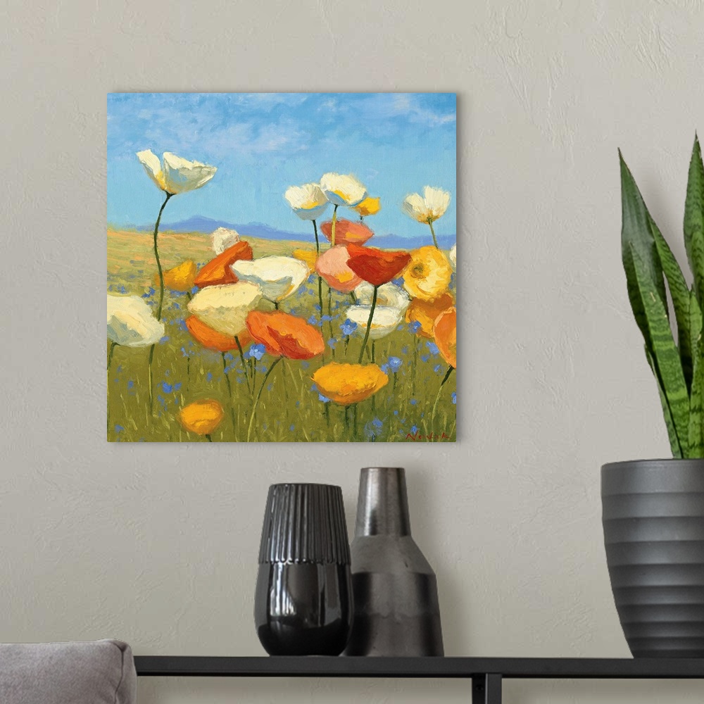 A modern room featuring Contemporary painting of flowers in a green field, with a blue sky above.
