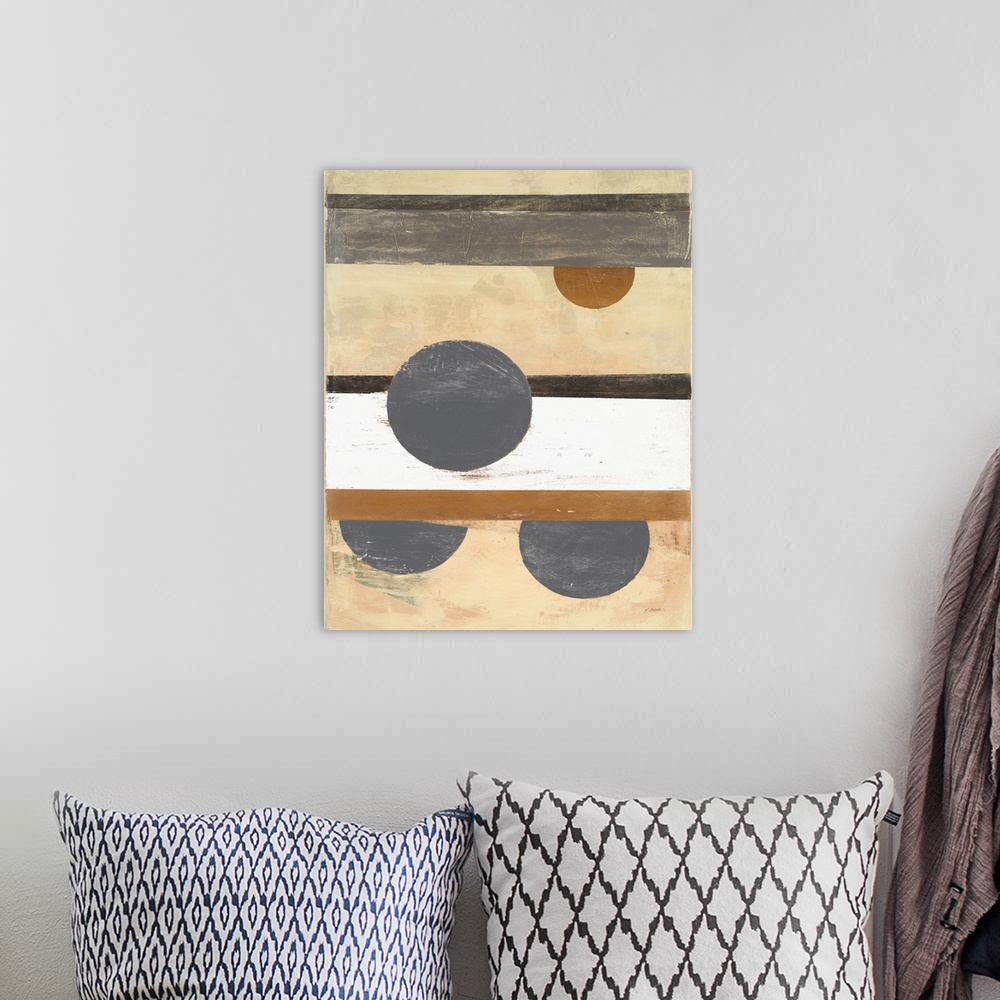 A bohemian room featuring Abstract painting with a striped background and circles on top in neutral colors.