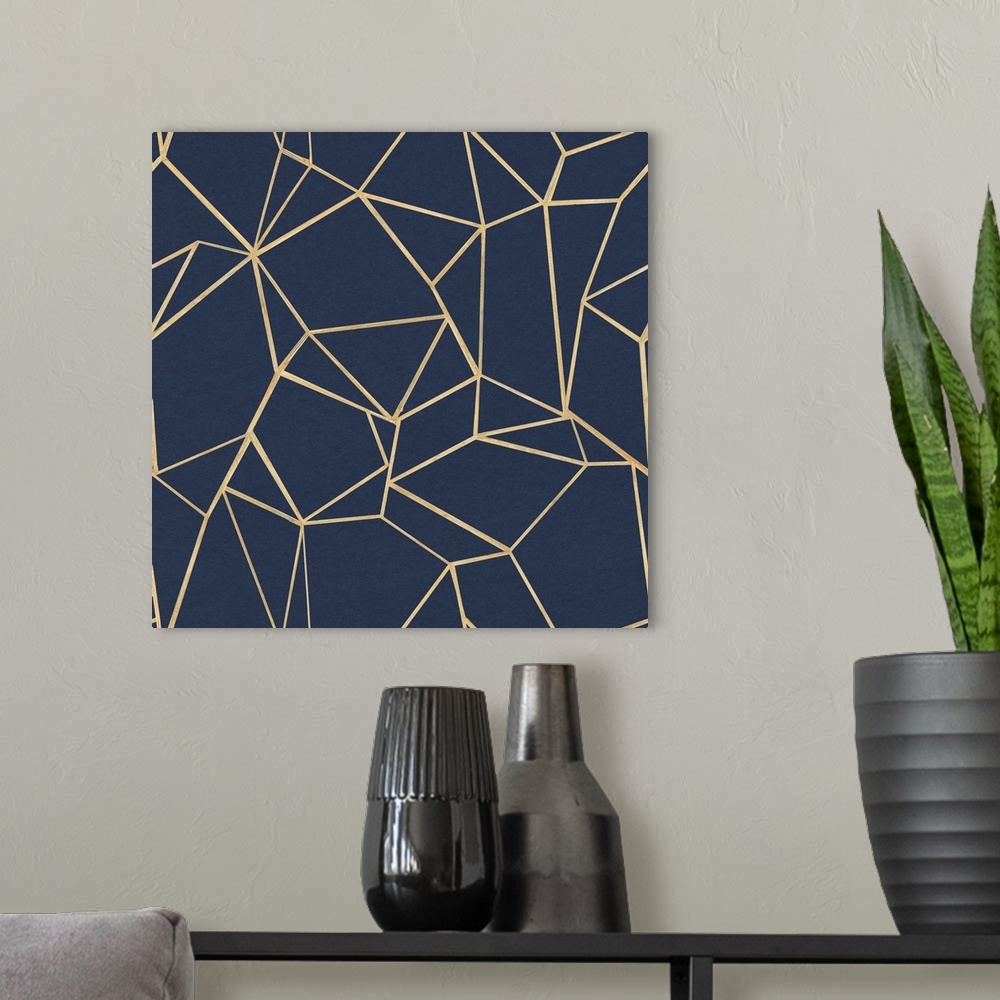 A modern room featuring A square design of geometric lines in gold on a navy background.
