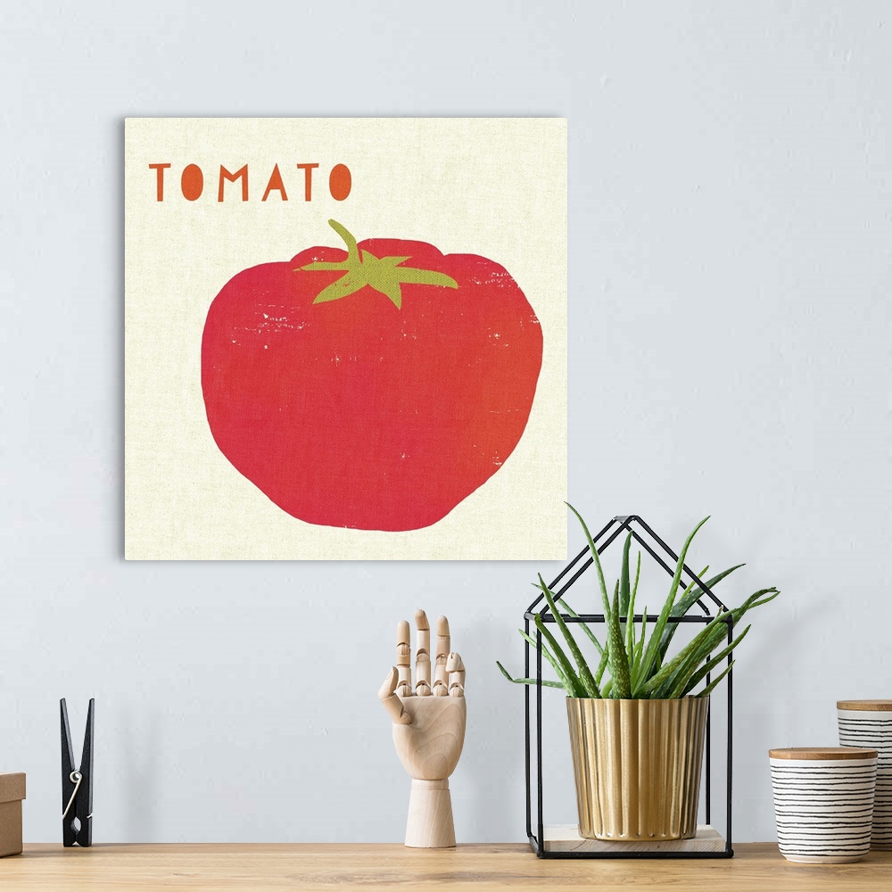 A bohemian room featuring Contemporary kitchen decor of a tomato against a neutral background.