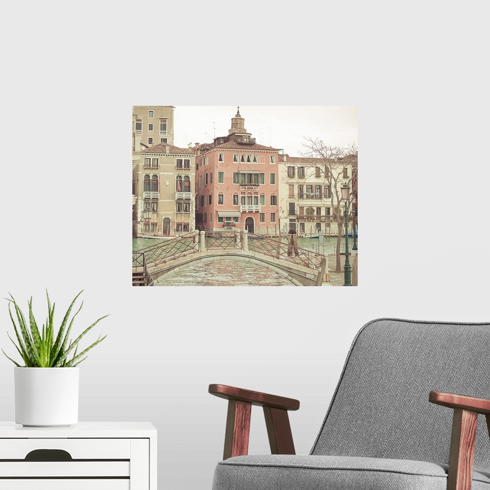 A modern room featuring Square photograph of a cityscape in Venice, Italy.