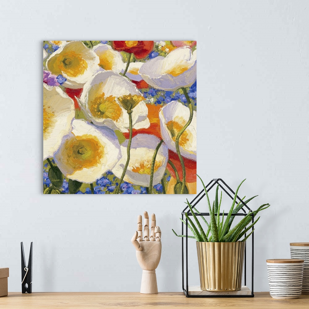 A bohemian room featuring Square painting of various colored flowers on canvas.