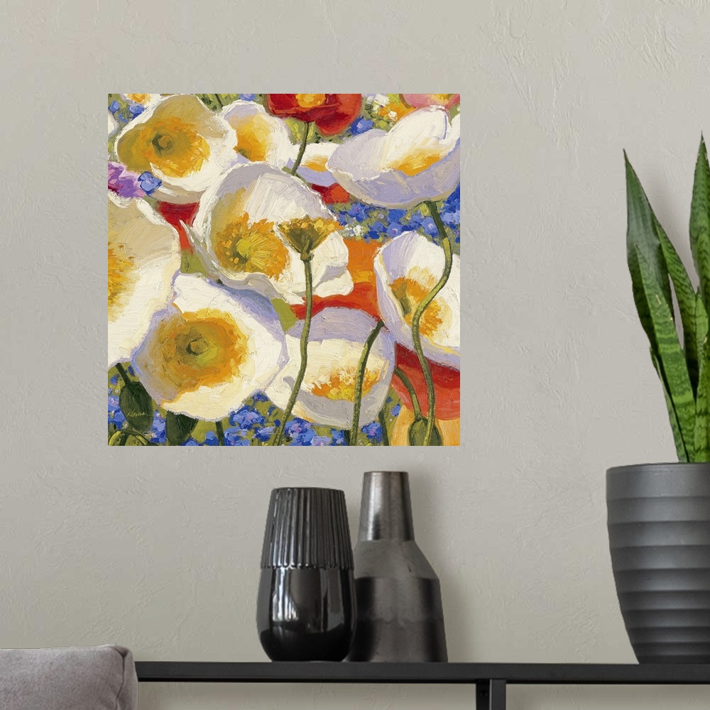 A modern room featuring Square painting of various colored flowers on canvas.