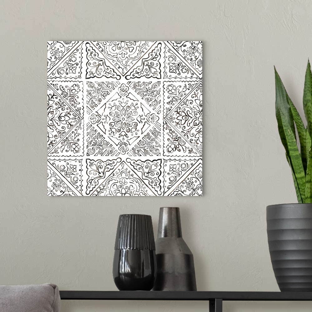 A modern room featuring A square decorative image of black and white floral designs in a tile pattern.