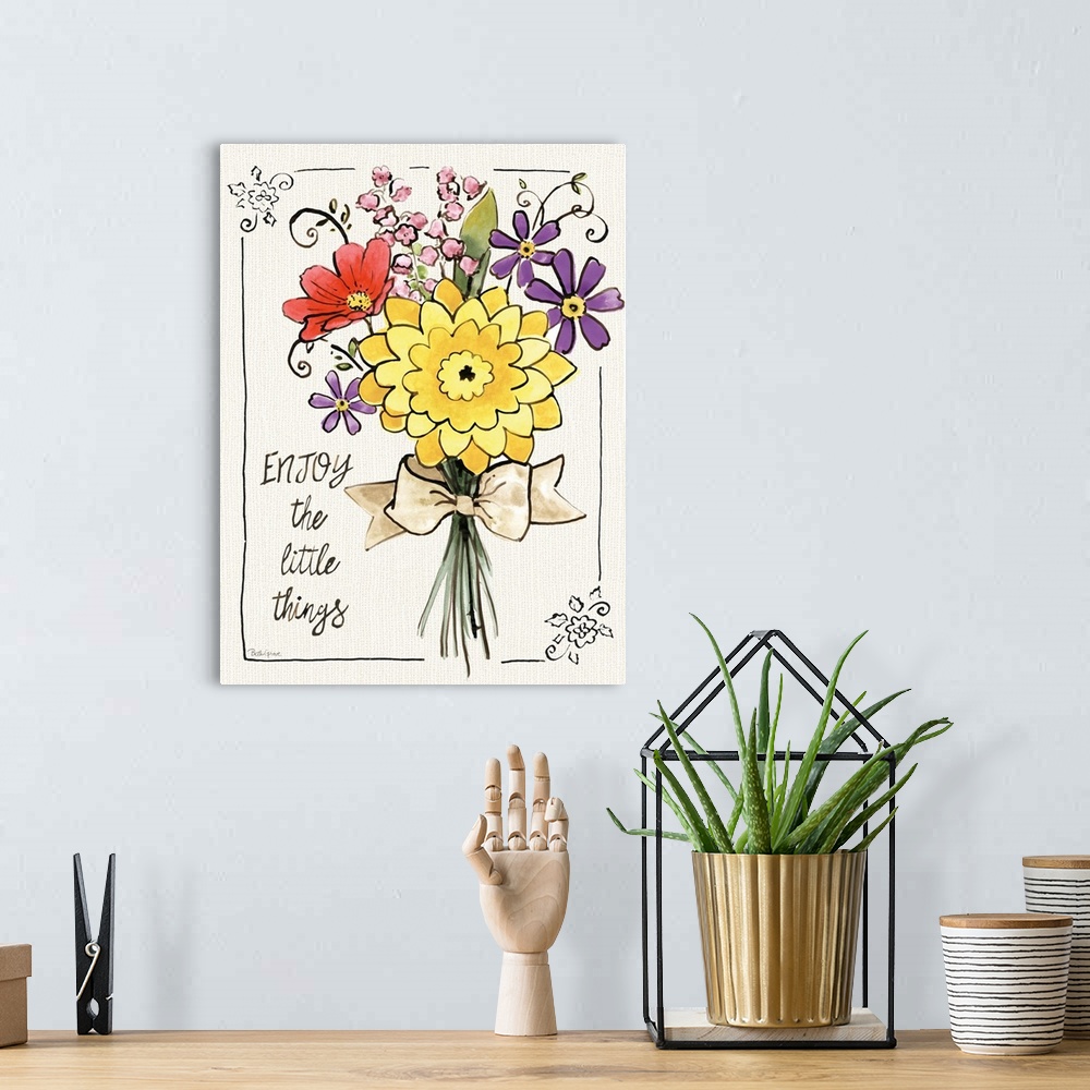 A bohemian room featuring "Enjoy The Little Things" written on the side of a colorful bouquet of flowers.
