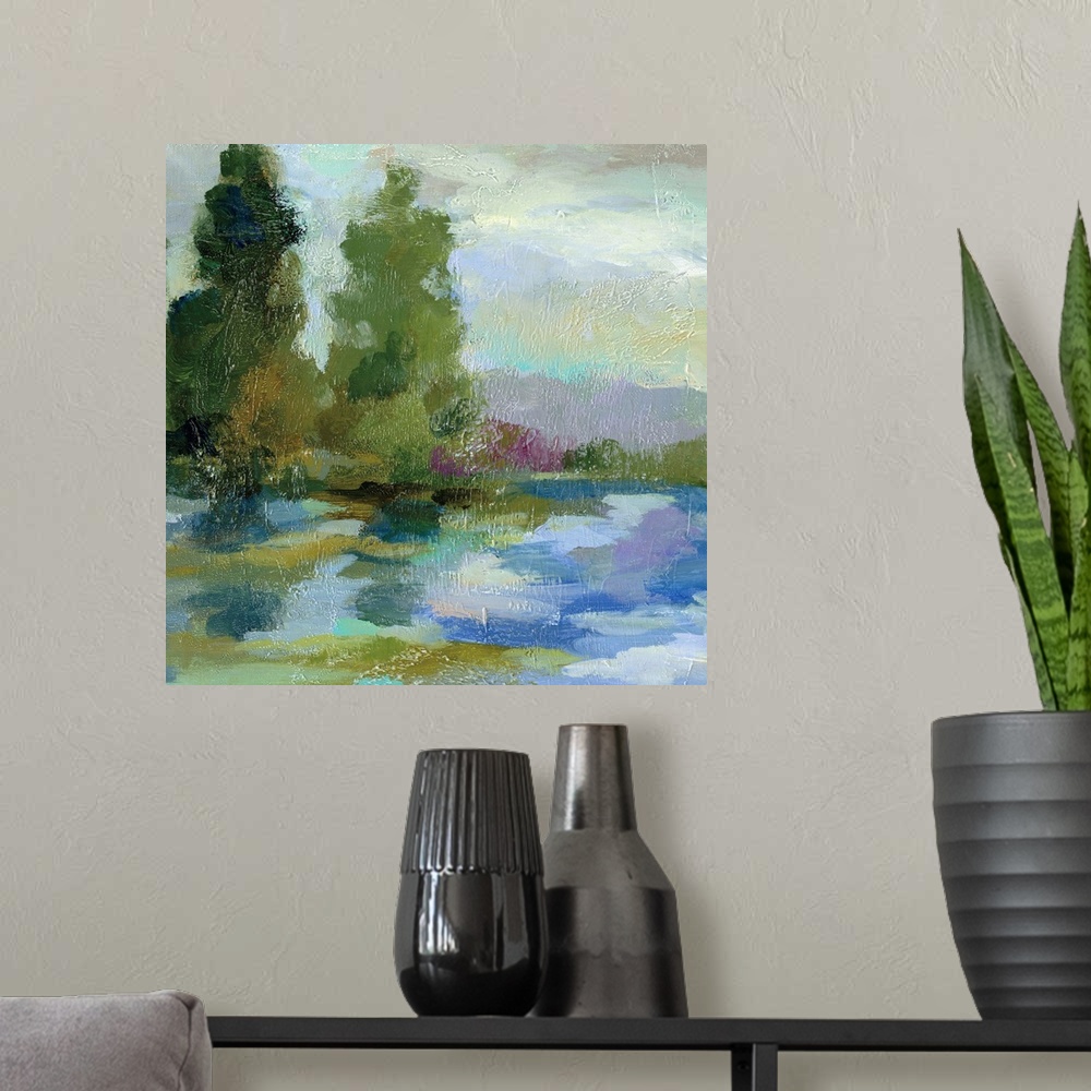 A modern room featuring Contemporary painting of a lake with tall trees on the shore.