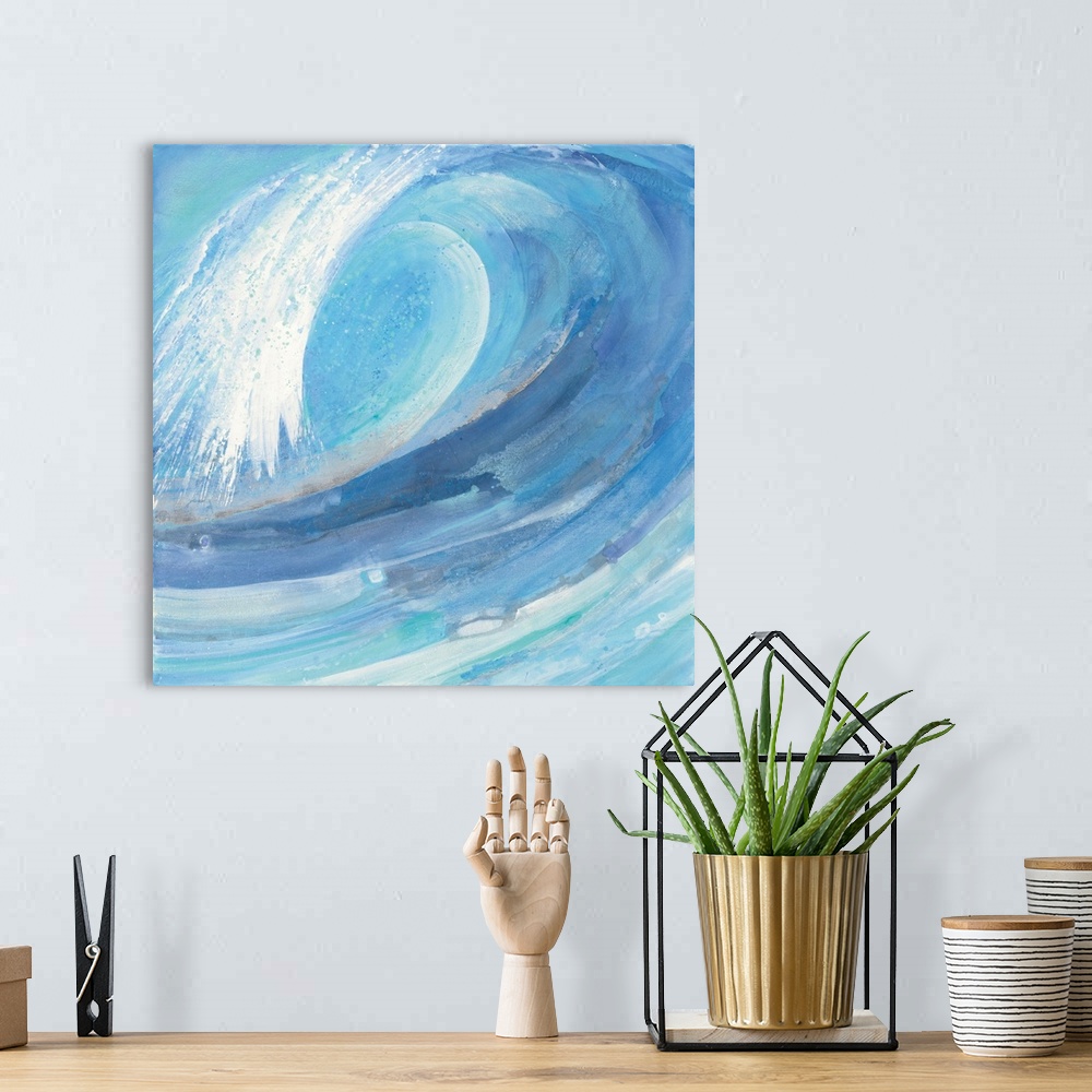 A bohemian room featuring A painting of a blue ocean wave curling in on itself.