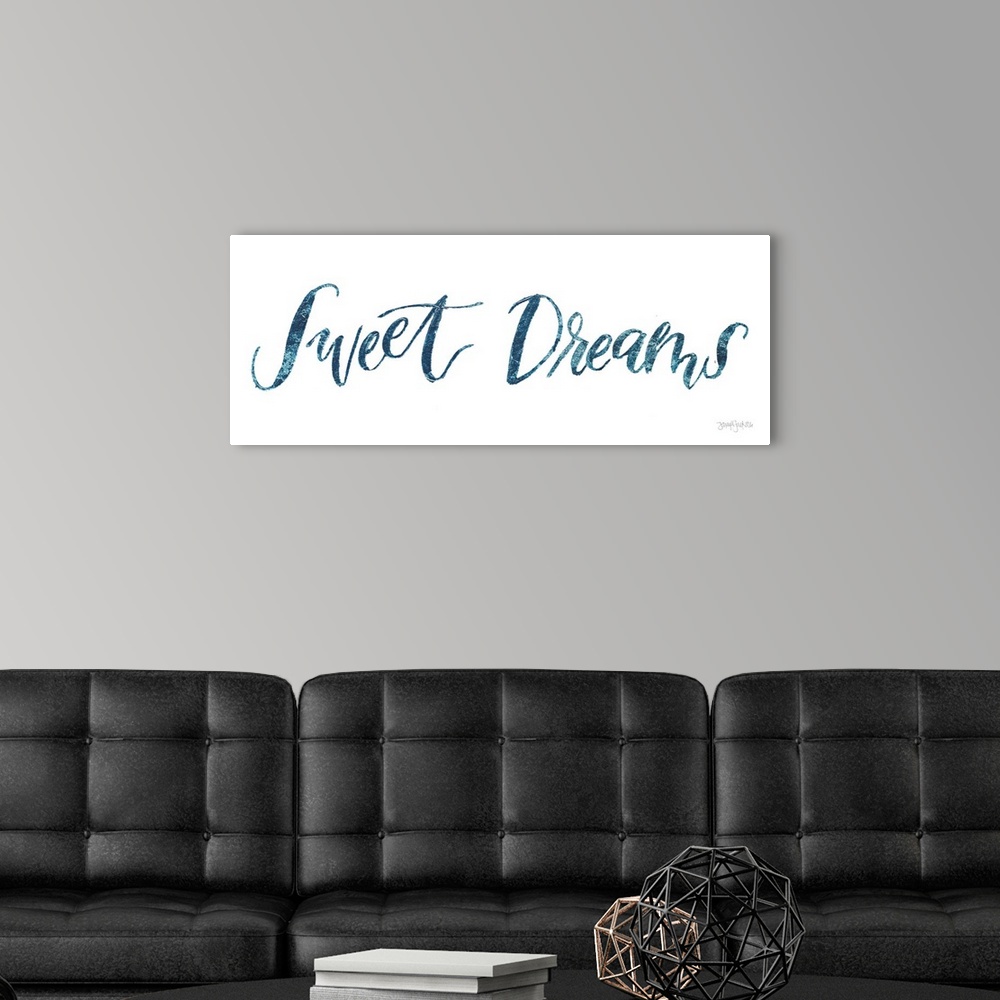 A modern room featuring "Sweet Dreams" handwritten in blue on a white background.