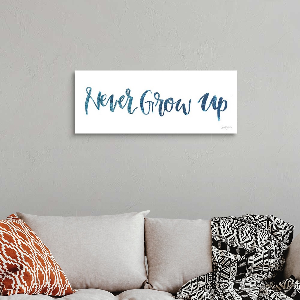 A bohemian room featuring "Never Give Up" handwritten in blue on a white background.