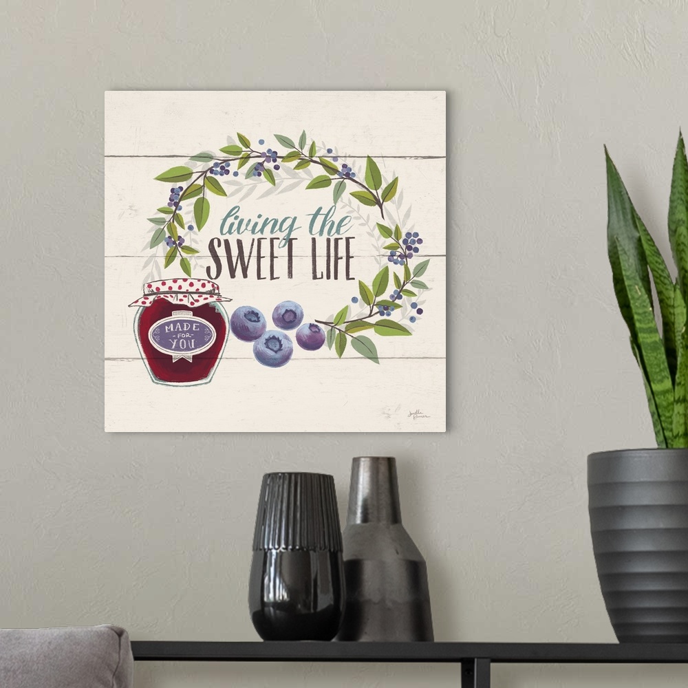 A modern room featuring "Living the Sweet Life" with blueberries.