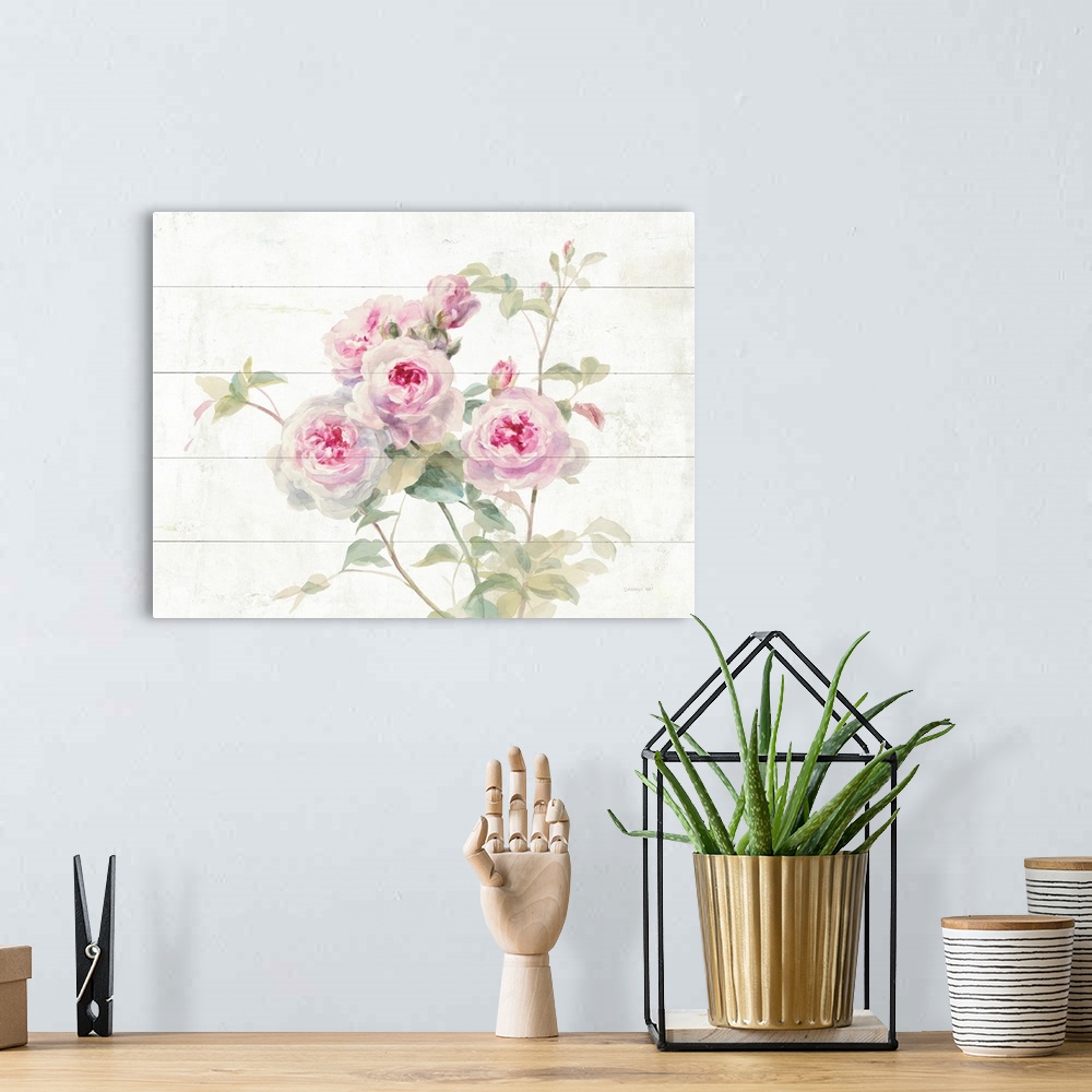 A bohemian room featuring Decorative artwork featuring romantic watercolor roses over white wood boards.