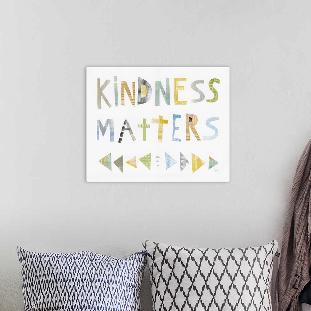 A bohemian room featuring Whimsy sentiment decor with the phrase "Kindness Matters" written in different colors.