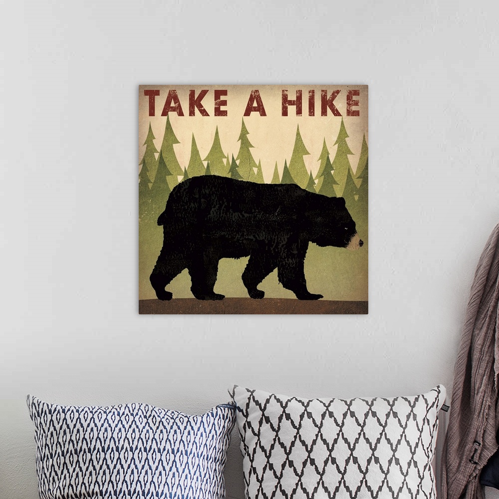 A bohemian room featuring Contemporary cabin decor artwork of a black bear sign for hiking.