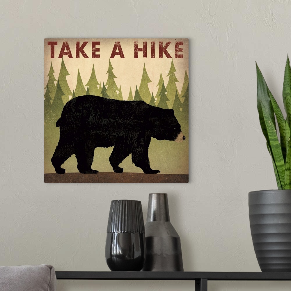 A modern room featuring Contemporary cabin decor artwork of a black bear sign for hiking.