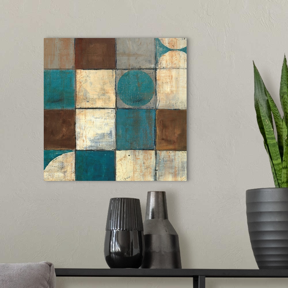 A modern room featuring Abstract painting of geometric shapes, with a couple of organic shapes all in warm and cool colors.