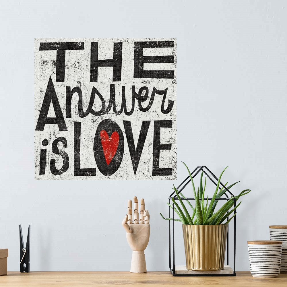 A bohemian room featuring Square painting on canvas with painted text and a grungy background.