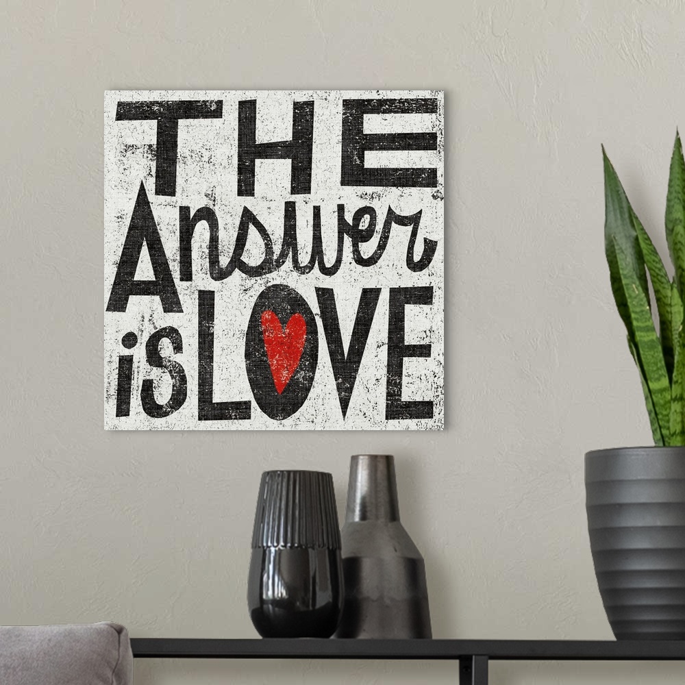 A modern room featuring Square painting on canvas with painted text and a grungy background.