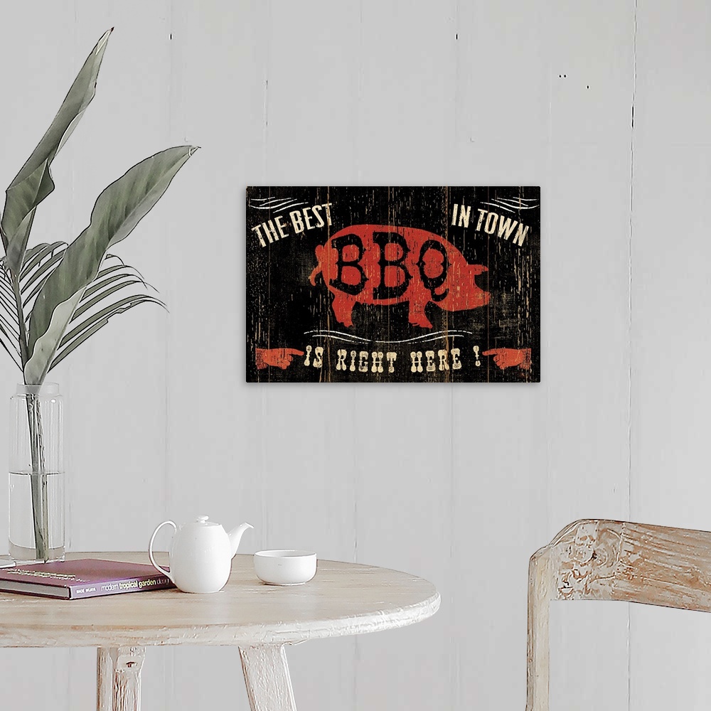 A farmhouse room featuring Contemporary artwork of an old weathered looking sign, with a red pig silhouette in the center of...