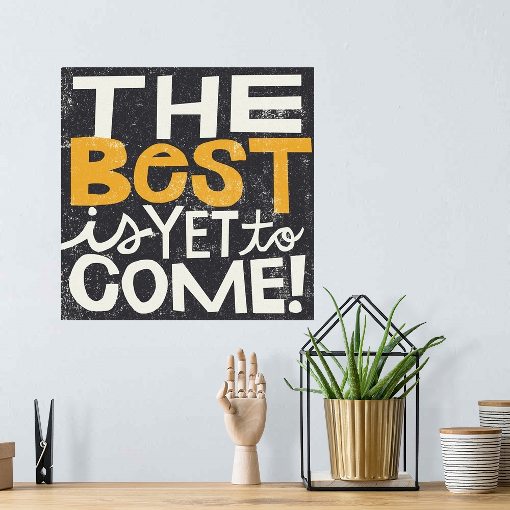 A bohemian room featuring Inspirational wall art featuring bright typography with the words the best is yet to come atop a ...