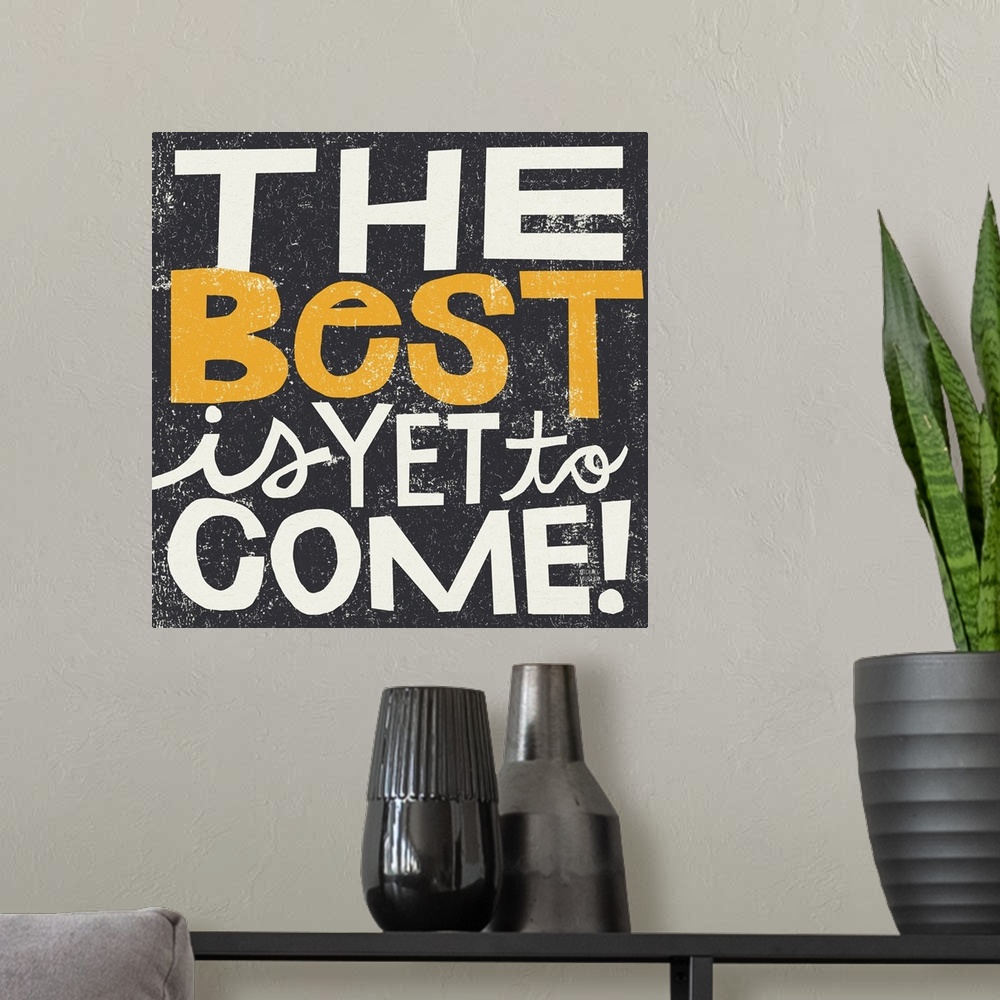 A modern room featuring Inspirational wall art featuring bright typography with the words the best is yet to come atop a ...