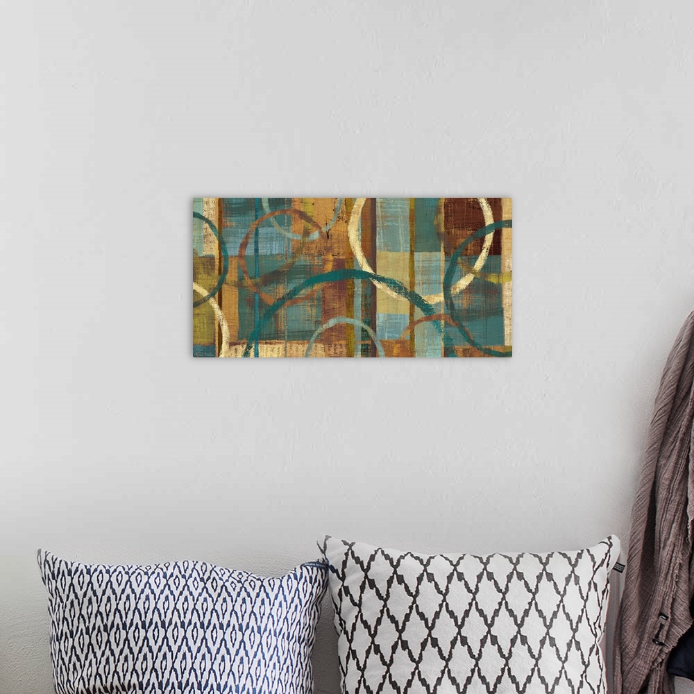 A bohemian room featuring Wide abstract oversized art painting of circles on a grid of paint squares.