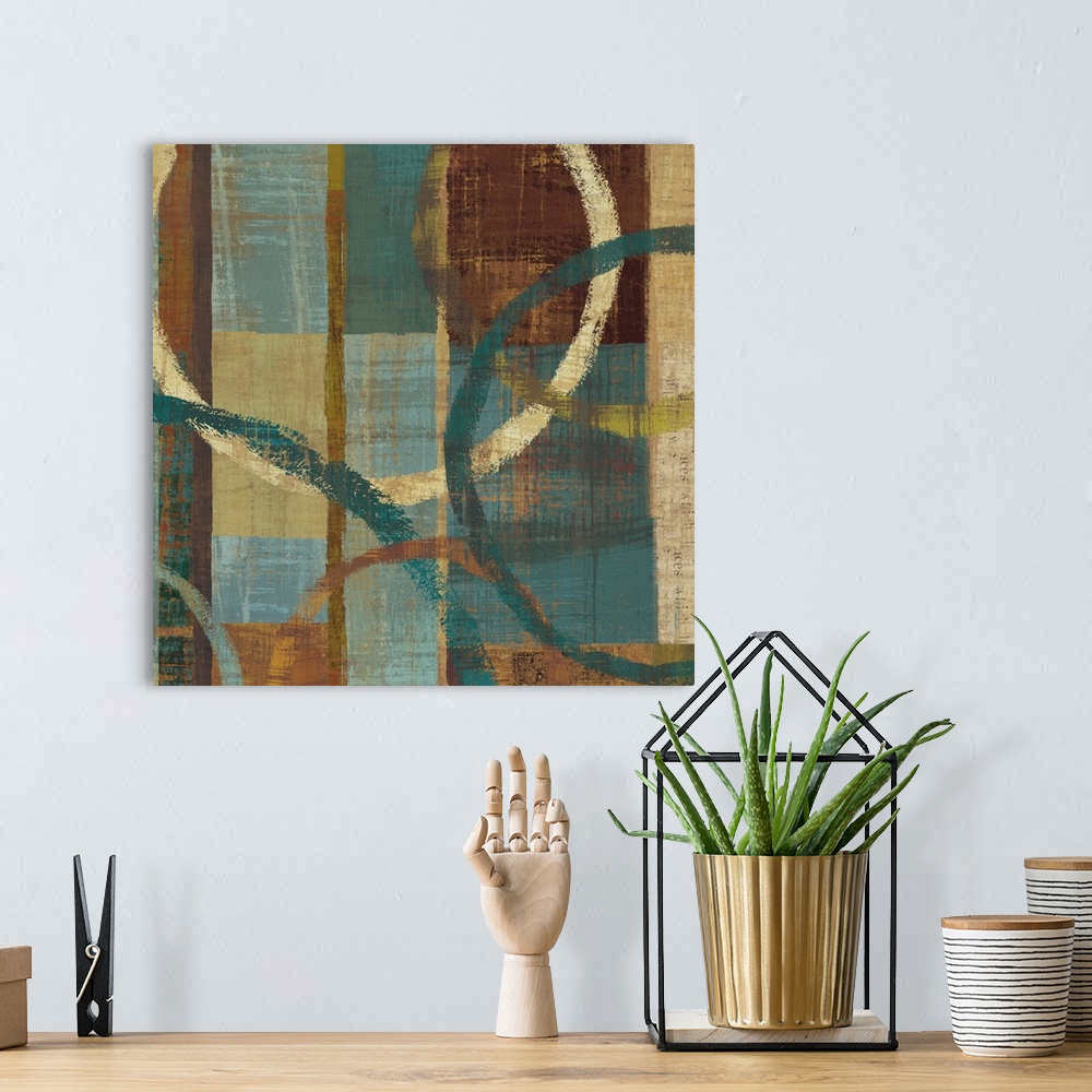 A bohemian room featuring An abstract piece of art with circles of different sizes hovering over a multi-colored weathered ...