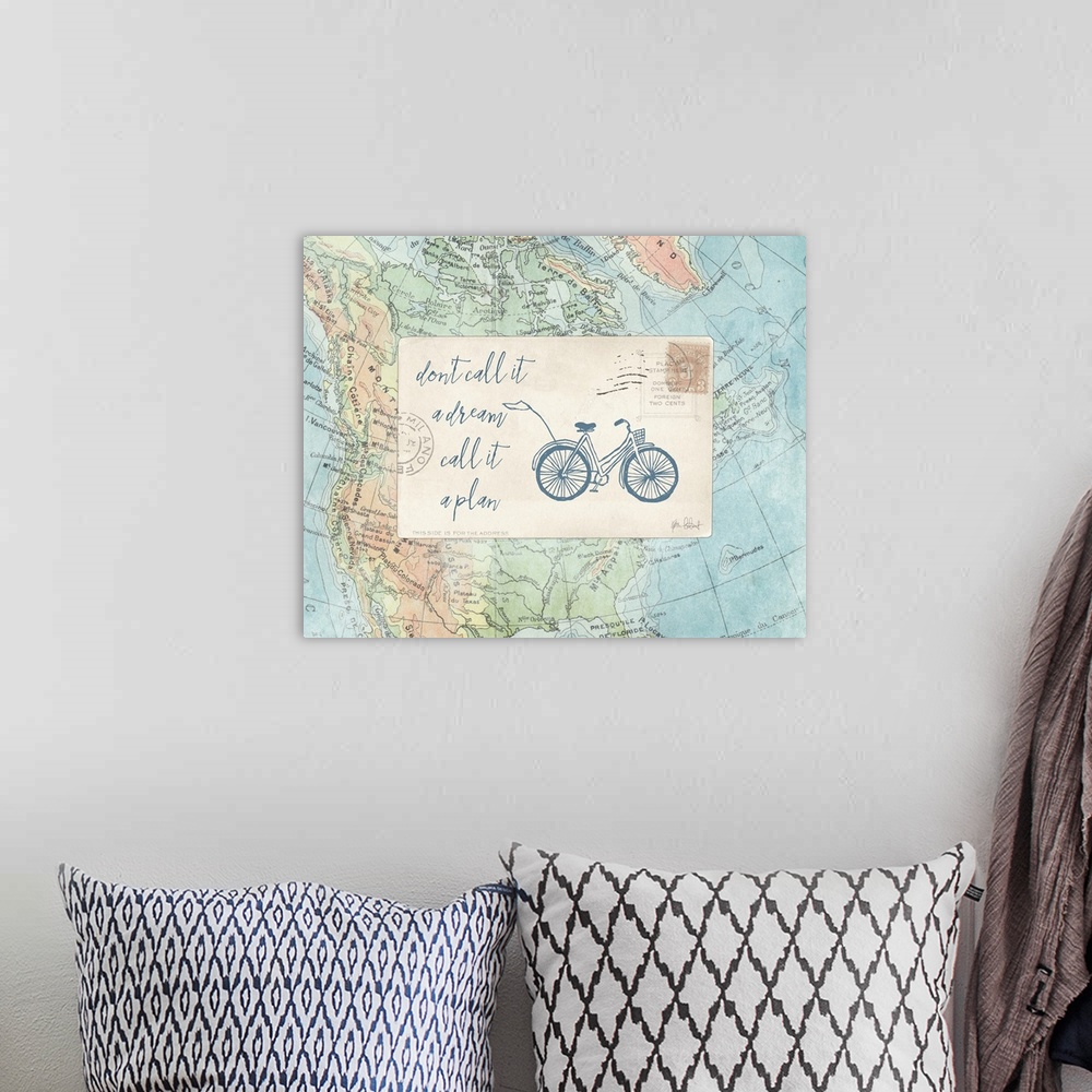 A bohemian room featuring "Don't Call it a Dream Call it a Plan" with a bicycle drawn in blue on a postcard on top of a map.