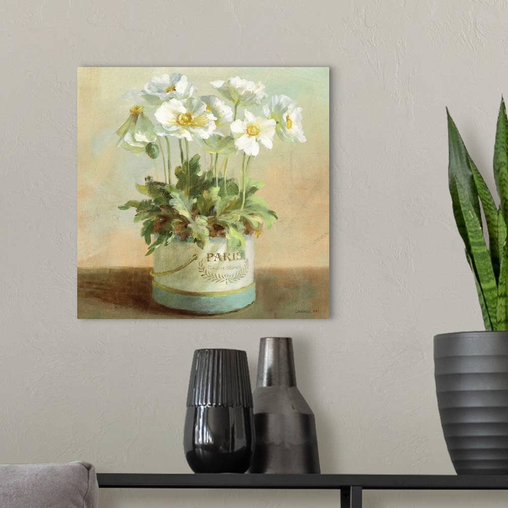 A modern room featuring Contemporary painting of white flowers in a planter sitting on a table.