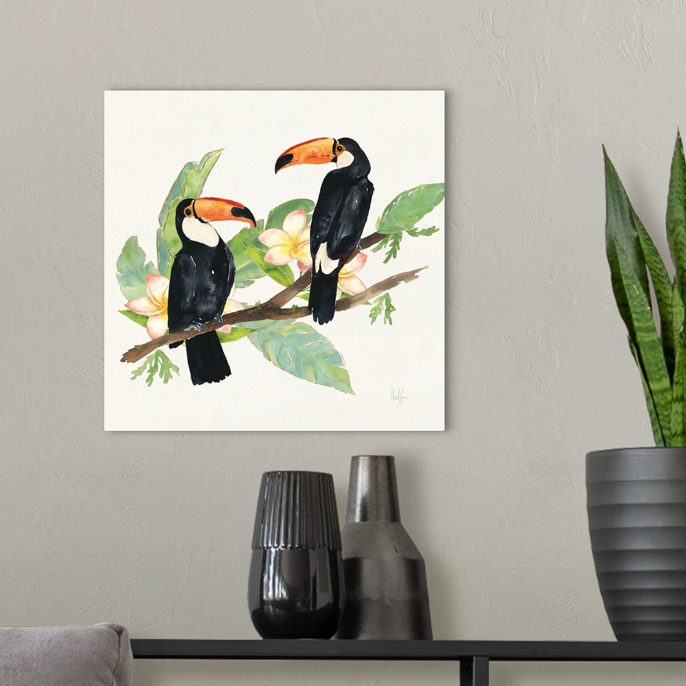 A modern room featuring Square watercolor painting of two toucans on a branch with green tropical leaves and pink orchids.