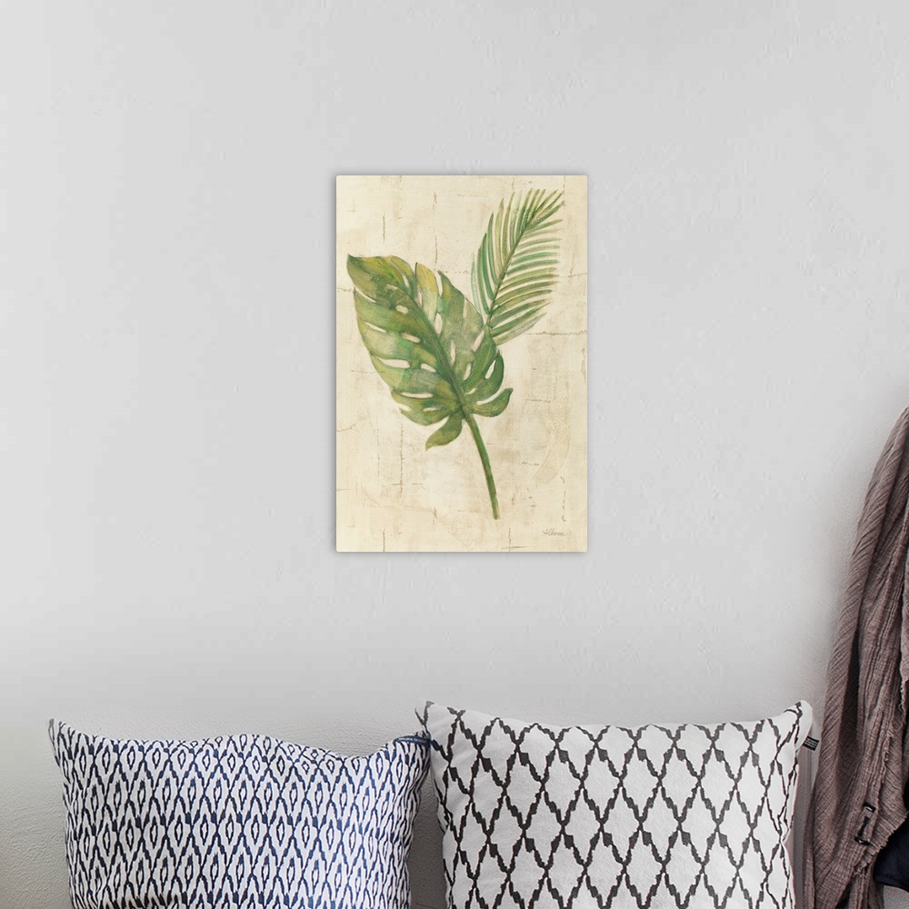 A bohemian room featuring Decorative artwork featuring tropical leaves over an aged background.