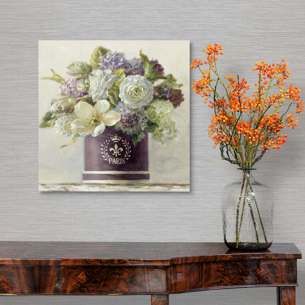 A traditional room featuring Still life painting of a hatbox filled with a variety of flowers against a soft background.
